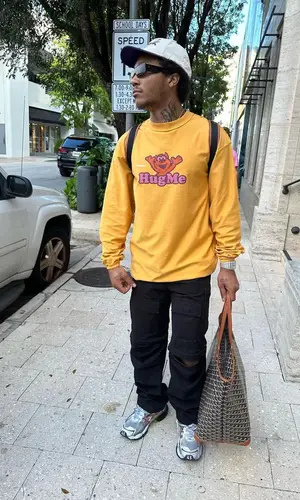 Lil Meech wearing Goyard backpack