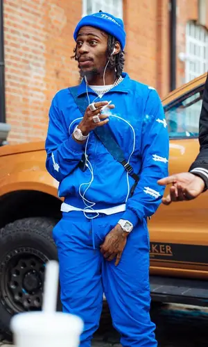 Russ Millions wearing Trapstar pants