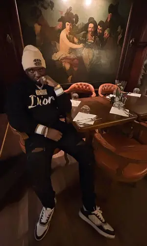 Headie One’s Outfit in Dior Hoodie, Amiri Jeans & Chanel Hat (2022)
