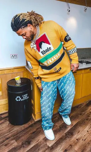 Chase Young wearing Rhude sweater