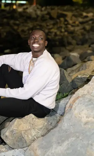 Bobby Shmurda wearing Saint Laurent sweatshirt