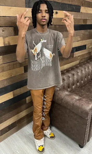 Lil Darius wearing Palidori pants
