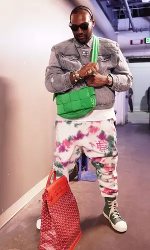 Peezy wearing Goyard backpack
