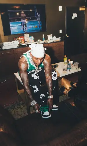 DaBaby wearing Denim Tears jeans