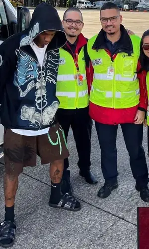 Travis Scott wearing Travis Scott Merch hoody
