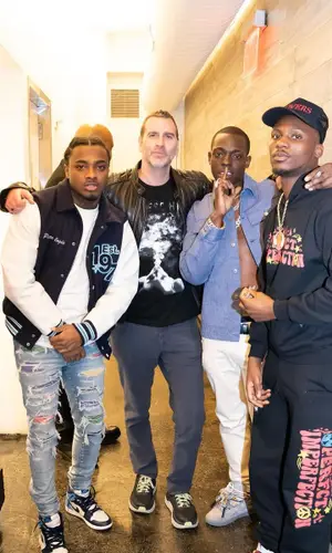 Bobby Shmurda wearing Dior shirt