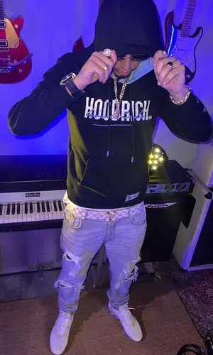 Veigh wearing Louis Vuitton belt