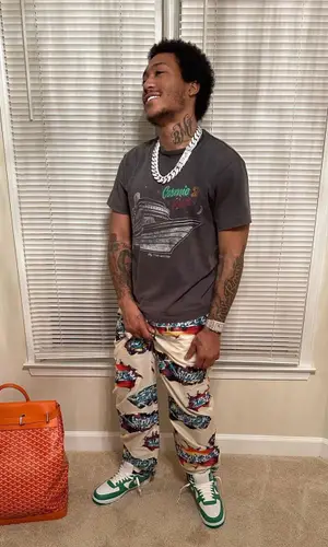 Lil Meech wearing Goyard backpack