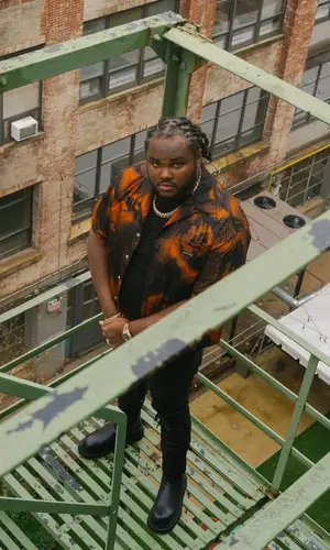 Tee Grizzley wearing Prada shirt