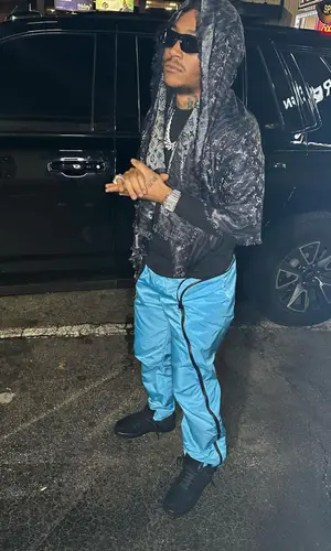 Lil Meech wearing Louis Vuitton scarf