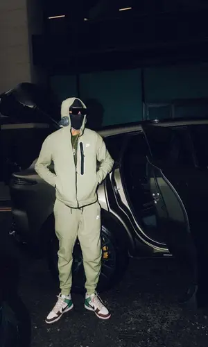 Meekz wearing Nike sneakers