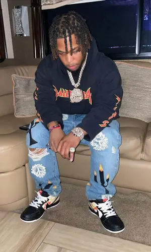 Don Q wearing Balenciaga hoody