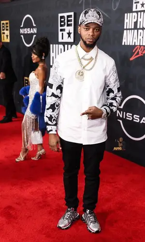 Papoose wearing Amiri jeans