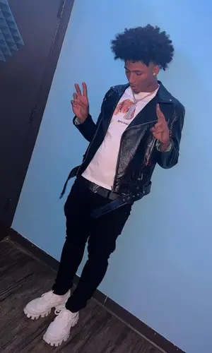Mikey wearing Valabasas jeans