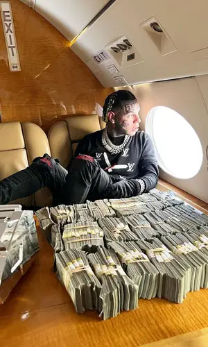 6ix9ine’s Outfit in Amiri Jeans & Louis Vuitton Eyewear (2022)