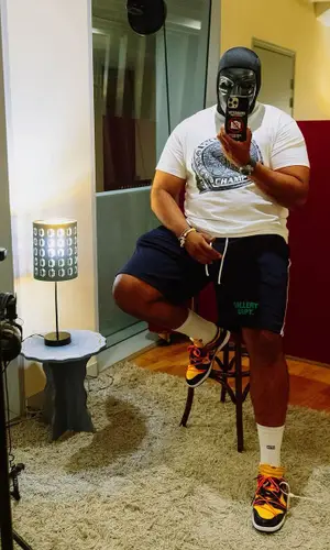 M Huncho wearing Nike sneakers