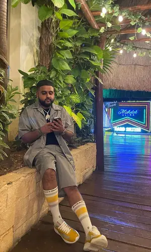 Nav wearing Prada sneakers