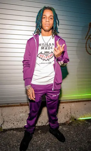 C Blu wearing Palm Angels pants