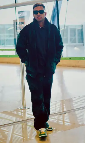 Rodrygo wearing Louis Vuitton backpack
