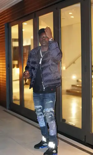 Burna Bandz wearing Dior jacket