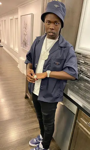 Burna Bandz wearing Prada hat