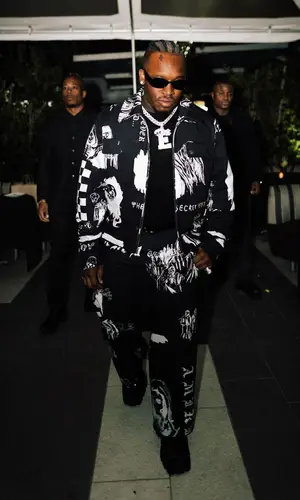 Blxst wearing Amiri pants