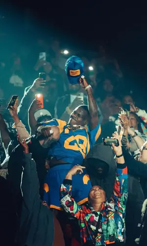 DaBaby wearing Mitchell & Ness shorts