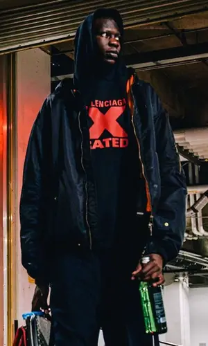 Bol Bol wearing Goyard bag