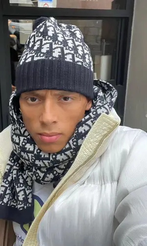 Central Cee wearing Dior scarf