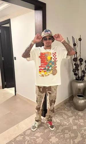 Jesse Lingard’s Outfit in Rhude T-Shirt, Gallery Dept. Jeans & Chrome Hearts Hat (2022)