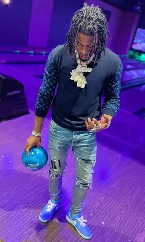 CJ So Cool wearing Louis Vuitton sweater