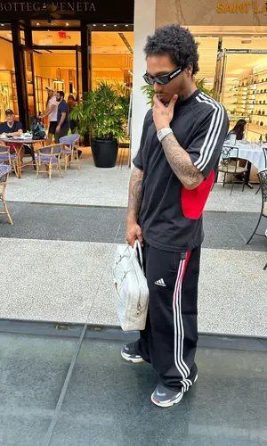 Lil Meech wearing Goyard bag