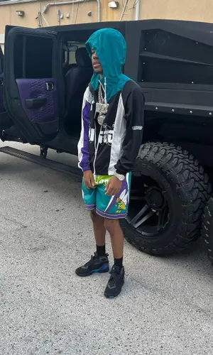 Nardo Wick wearing Louis Vuitton shorts
