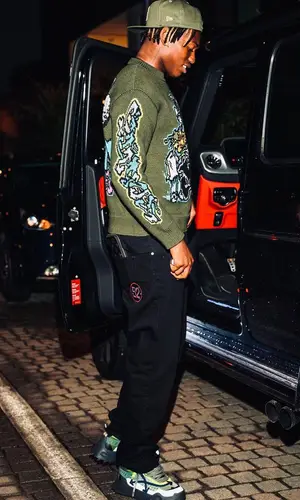 Rafael Leao wearing Off-White sweater