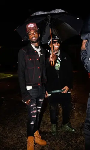 Lil Gotit wearing Palm Angels hat