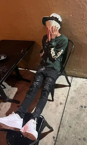 Luh Tyler wearing Fame And Fortune sweater