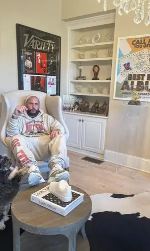 DJ Drama wearing Denim Tears hoody