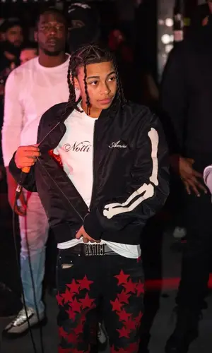 DD Osama wearing Amiri cap