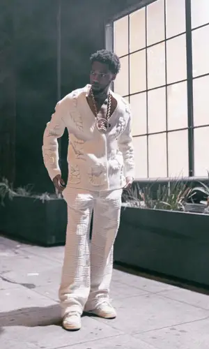 Key Glock wearing Bottega Veneta sweater