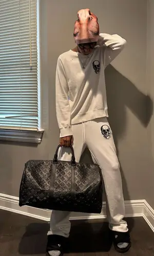 Yung Fazo wearing Number (N)ine pants
