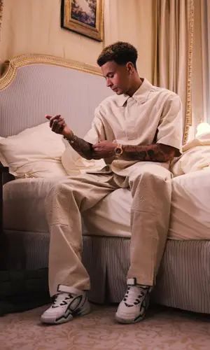 Dele Alli wearing Louis Vuitton pants