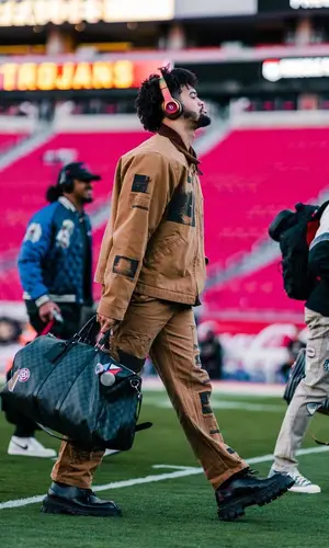 Caleb Williams wearing Travis Scott Merch pants