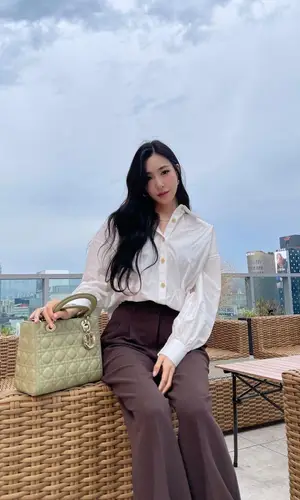 Tiffany Young’s Outfit in Khaite Top, Nike Sneakers & Dior Bag (2022)