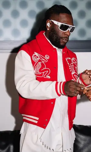 Burna Boy wearing Louis Vuitton jacket
