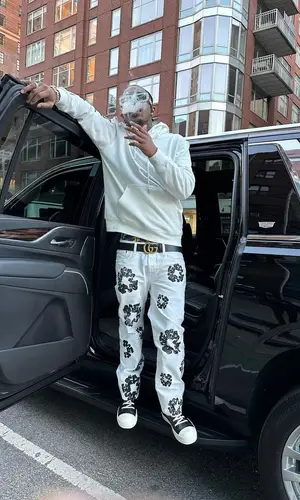 Loe Shimmy wearing Gucci belt