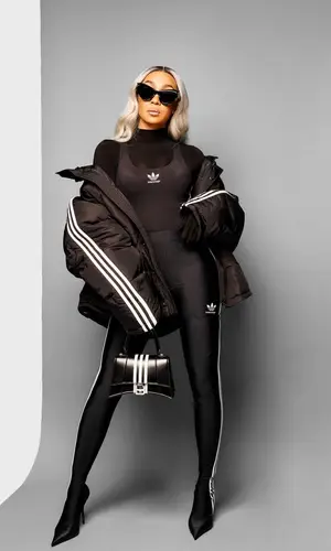 Monica wearing Adidas bag