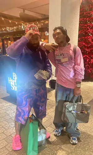 Lil Meech wearing Goyard bag