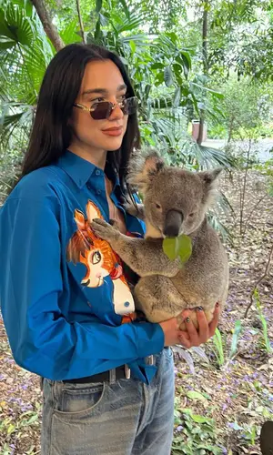 Dua Lipa wearing Moschino shirt