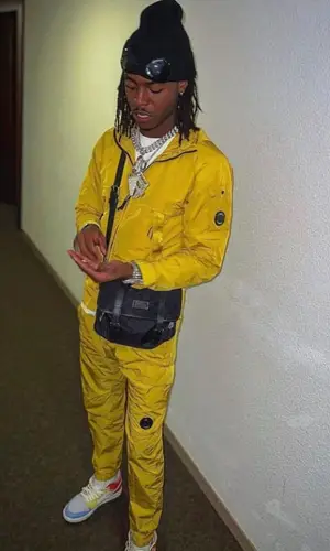 Koba Lad wearing Nike sneakers