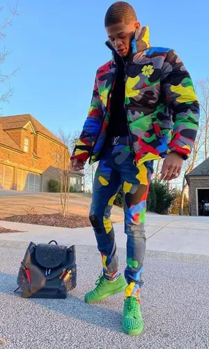 YK Osiris’ Outfit in Filthy Wealth Jacket, Christian Louboutin Sneakers & Louis Vuitton Belt (2022)